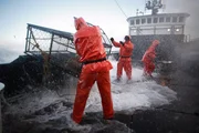 Time Bandit crew in action on deck.
