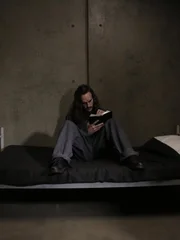 Charles Manson sits in jail for murders he was convicted of.