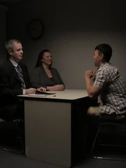 A student who went to Eric's University came to the Police to say that his roommate had a coat just like the room that was being show on TV.