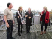 Portrait shot of contributors Heather and Norman Jachinski (left) with their daughter Megan (middle) and agent Sarah Eggar (right) in Amsterdam, Netherlands, as seen on Heather and Norman's house tour on House Hunters International (portrait)