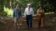 Portrait of Matt Raney, Marty Raney, and Misty Bilodeau walking down a paved path in the forest during hero shots.