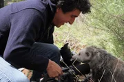 Camera operator and possum.