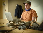 Lucas 'Chuke' Rowley, by a laptop as he examines evidence from Alaska