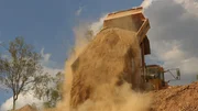 Sand spilling with the help of a truck. Sand spilling with the help of a truck.