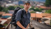 Mid shot of Parker Schnabel overlooking the city, Brazil.