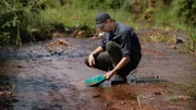 Parker Schnabel panning for gold in Serra Pelada, Brazil