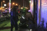 DETROIT - CBP outside illegal rave party raid with arrested people.