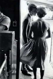 In a rare public display of affection, Jack kisses his wife good-bye at the Hyannis airport before he heads back to Washington