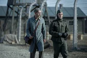 Jonah Hauer-King as Lali Sokolov & Jonas Nay as Nazi Officer Stefan Baretzki in Auschwitz.