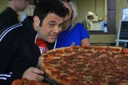 Host Adam Richman gets ready.