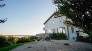 The Sunset Cove House in nearby Charlestown, Rhode Island, as seen on HGTV's Beach Hunters. The Sunset Cove House in nearby Charlestown, Rhode Island, as seen on HGTV's Beach Hunters.