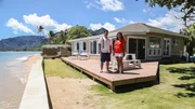 As seen on HGTV's Beach Hunters, homebuyers Amir and Alma pose for a photo after touring the Ocean Breeze House on the island of Oahu.