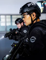 l-r: Officer Jim Street (Alex Russell), Officer Victor Tan (David Lim)