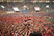 Tarragona, SPAIN - A team begins their construction of a "human tower" - this traditional Catalan competition is held yearly in Tarragona, Spain - teams must compete to build the tallest and most complex tower.
