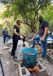 Mariana van Zeller (foreground L) talking with a masked individual. (Credit: National Geographic)