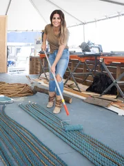 As seen on HGTV's Battle on the Beach, Alison Victoria paints rope in the workshop to create a unique art piece for the living room.