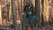 Willy getting rope ready for his tree climb.