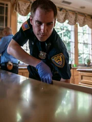 Police officers searching through home of Sherra Wright.