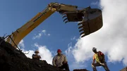 Jack and Todd Hoffman at near the whoe of the first cut with the Hitachi 200 Excavator at the Claim.
