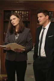 BONES: Brennan (Emily Deschanel, L) and Booth (David Boreanaz, R) interview an immigration lawyer in the "The Survivor in the Soap" episode of BONES.