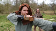 Host Josh Gates prepares to shoot a longbow in Sherwood Forest, England as he tries out the weapon of choice for Robin Hood and his merry men, on Travel Channel's Expedition Unknown.