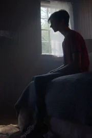 Paul Keller watches a fire burn on TV.