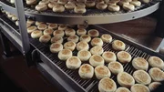 Bakery producing English muffins, elevated view
