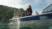 Emily Riedel throws anchor during an exploratory trip to Sledge Island with Zeke Tenhoff.