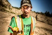 Parker Schnabel holding a gold nugget.