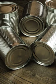 Aluminum cans on wooden background