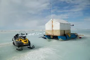 Ice dredge and snowmobile.