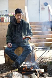 Bob roasting hot dogs.