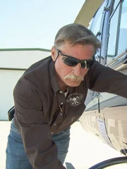 Kevin Lacey pushes helicopter.