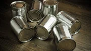 Aluminum cans on wooden background
