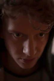 Dan staring mysteriously.