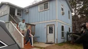 Buyers Audra Krieg (R) and Jason Krieg (L) walk down the outdoor stairs at Blue Heron house, as seen on HGTV's Beachfront Bargain Hunt: Renovation.