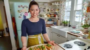 Candid shot of Molly Yeh making her Pork Meatball Banh Mi, as seen on Girl Meets Farm, season 8.