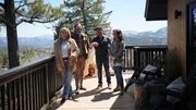 Jessica and Jason Mannon and Ben and Cristi Dozier stand on the Mannons' newly renovated back deck, all smiles about the changes that have been made to the home, as seen on Building Roots, Season, 2.