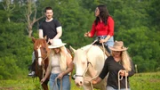 Clayton and Anali continue to talk while riding horses on a ranch in Kentucky.