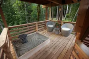 The exterior balcony of the towering treetop treehouse.