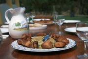 Die Migas &agrave; Alentejana sind eine wahre Delikatesse. Zur Brotteig-Beilage gibt es immer das saftige Fleisch der Alentejo-Schweine.
