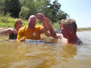 Chuck, Skipper, and Dena admire Chuck&rsquo;s catfish.