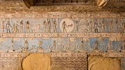 Ancient Egyptian carved and painted ceiling in the hypostyle hall of Abydos Temple. Note the goat Aries and the two fish of Pisces.