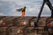 Kodiak Deckhand Rodrigo Castillo works with crab pots on the Bering Sea during King Crab season on Deadliest Catch season six. (photo by Rick Gershon/Reportage by Getty Images)