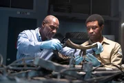 The Lead Namibian Investigator (played by Jamaal Grant) and Investigator Dennis Jones (played by Glen Michael Grant) work together to analyze pieces of wreckage to find out what happened to LAM Mozambique Flight 470. (Cineflix/Pana Pantazidis) The Lead Namibian Investigator (played by Jamaal Grant) and Investigator Dennis Jones (played by Glen Michael Grant) work together to analyze pieces of wreckage to find out what happened to LAM Mozambique Flight 470. (Cineflix/Pana Pantazidis)