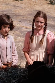 Albert Quinn Ingalls (Matthew Labyorteaux, l.); Laura Ingalls (Melissa Gilbert, r.)