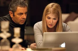 l-r: Johnny English (Rowan Atkinson),  Kate (Rosamund Pike)