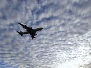 A plane flying over JFK airport.