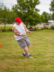 Chris pulls a tire as part of a workout his family is making him do. Chris pulls a tire as part of a workout his family is making him do.