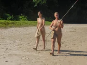 L-R:  Nicole and Angela walking across the sand.